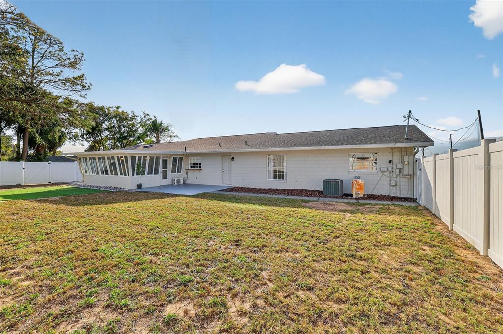 1101 Country Club Road Eustis, FL 32726 - Photo 43 of 44 a view of a house with a yard