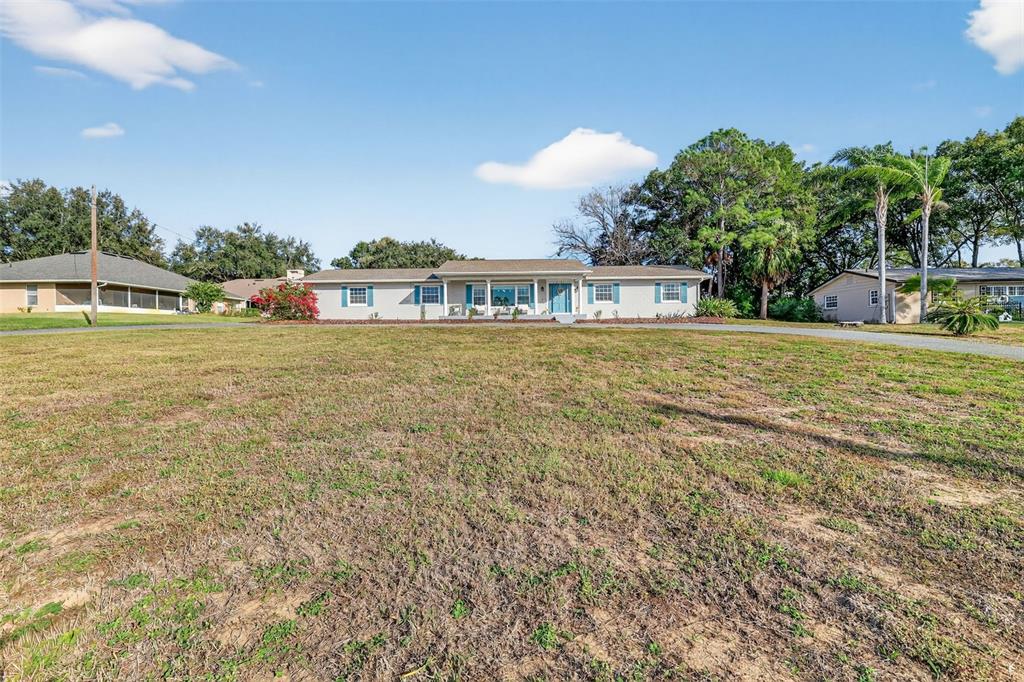 1101 Country Club Road Eustis, FL 32726 - Photo 44 of 44 a front view of a house with a yard