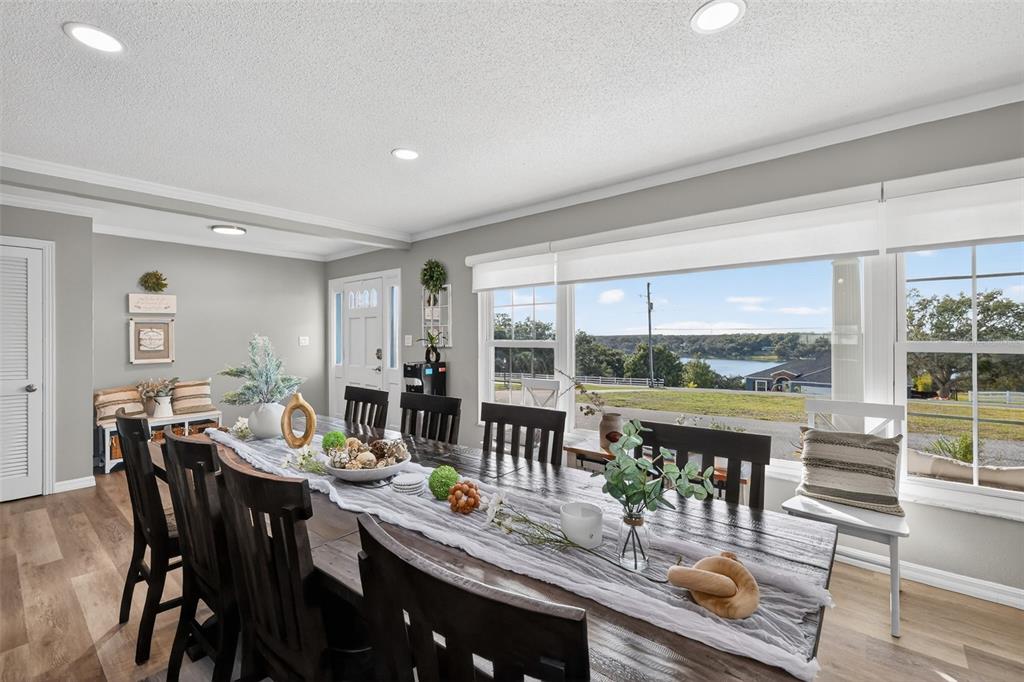 1101 Country Club Road Eustis, FL 32726 - Photo 7 of 44 a view of a dining room with furniture window and outside view