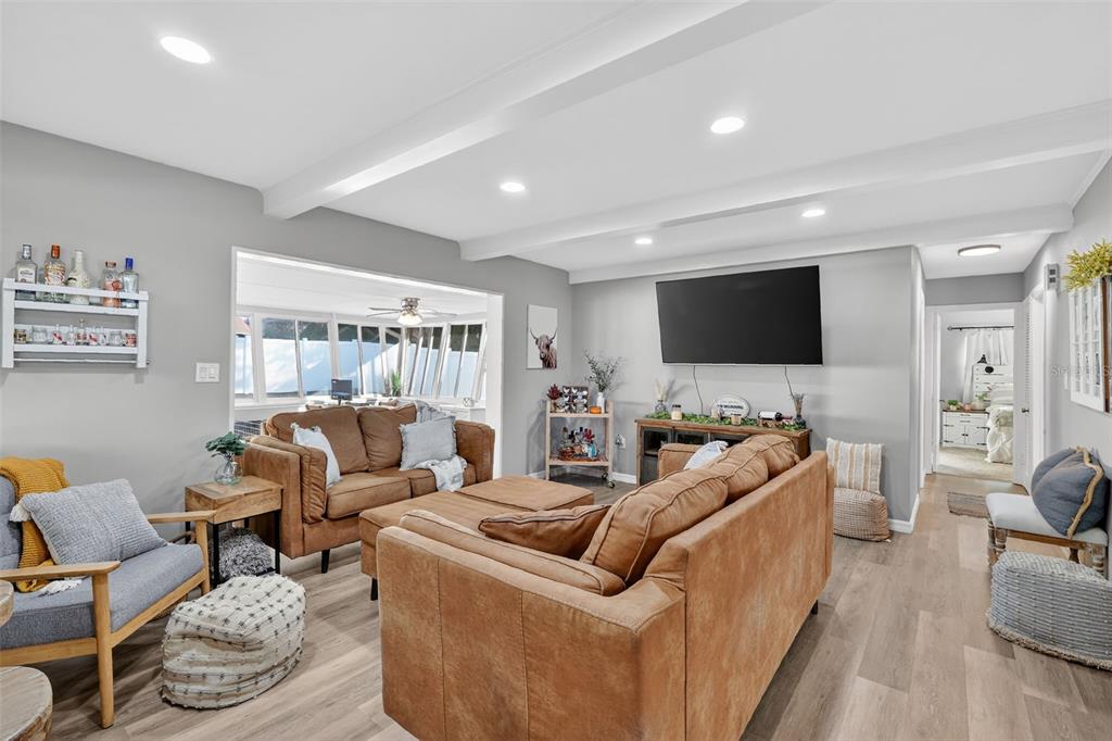 1101 Country Club Road Eustis, FL 32726 - Photo 10 of 44 a living room with furniture and a flat screen tv