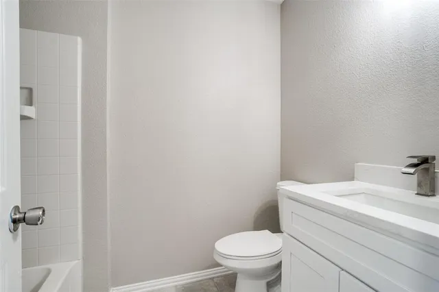 a bathroom with a sink and toilet