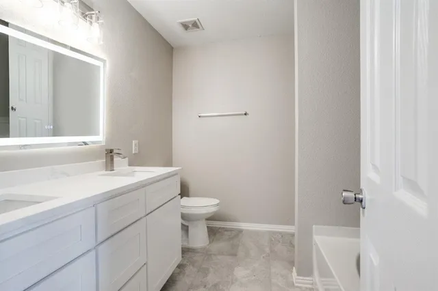 a bathroom with a sink and a toilet