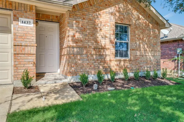 a view of a backyard with a garden