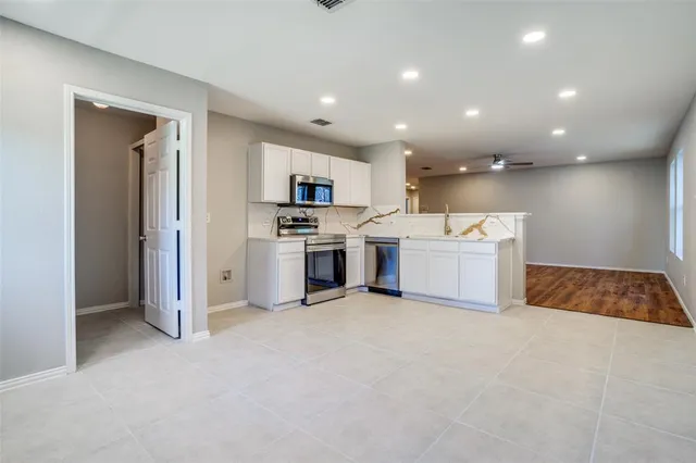 a view of kitchen and microwave
