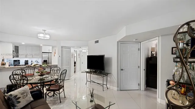 a view of a livingroom with furniture and a flat screen tv