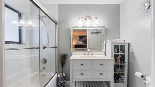 a bathroom with a double vanity sink and a mirror