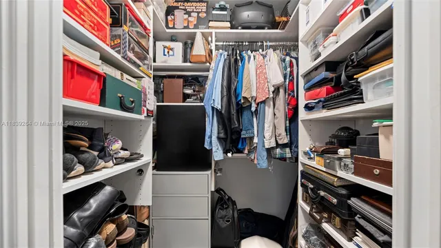 a utility room with lots of different colored cloths