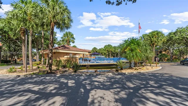 a view of a lake with a house in the background