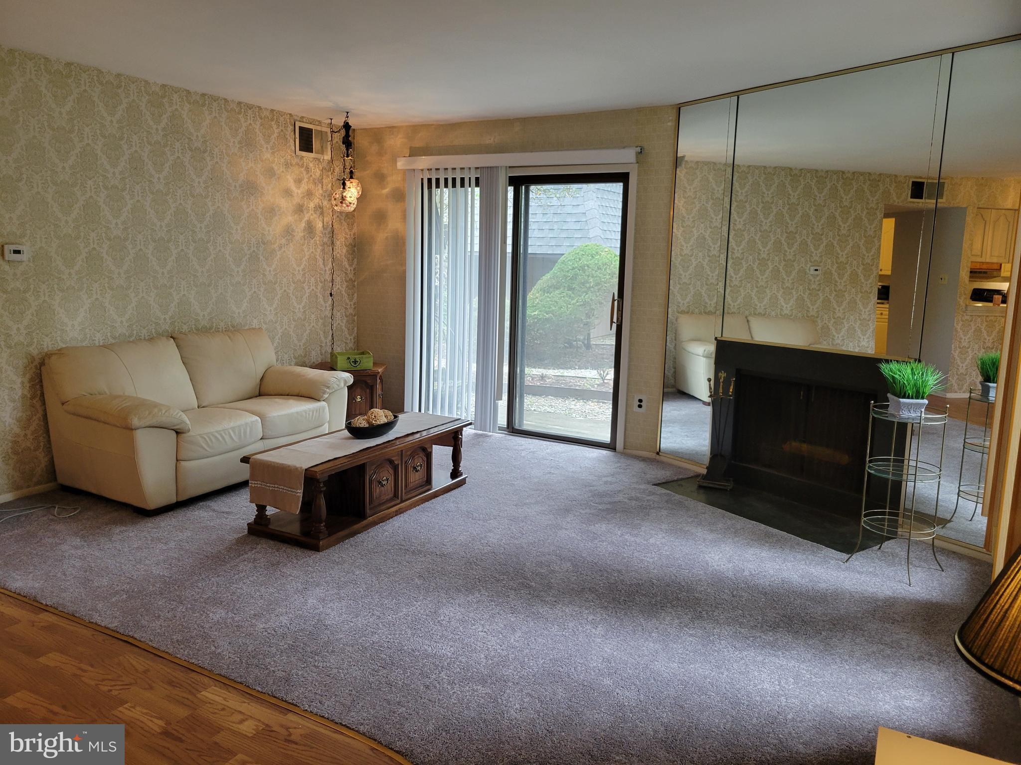 25 South Church Road, Unit 111 Maple Shade, NJ 08052 - Photo 3 of 18 Large Living Room w Sliding Door to Patio