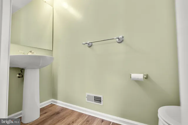 a bathroom with a sink and toilet