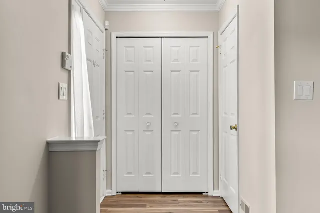 a view of an entryway with wooden floor