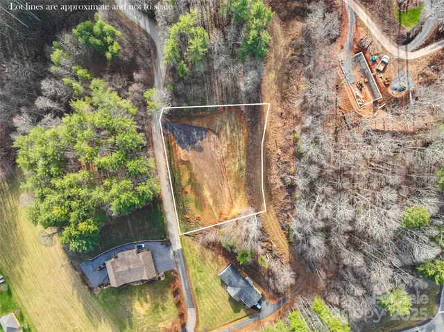 a view of a yard with two chairs