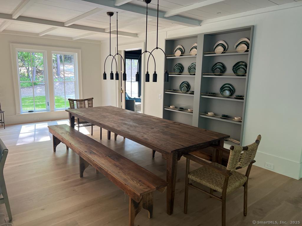 Undisclosed Address Litchfield, CT 06759 - Photo 11 of 22 a view of a dining room with furniture and window
