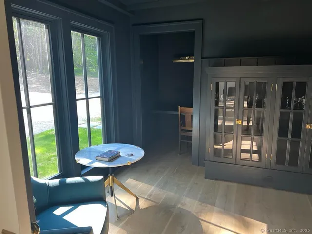 a view of a room with furniture and a window