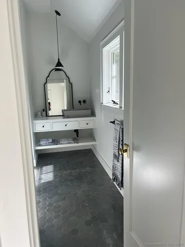 a view of a hallway to a room