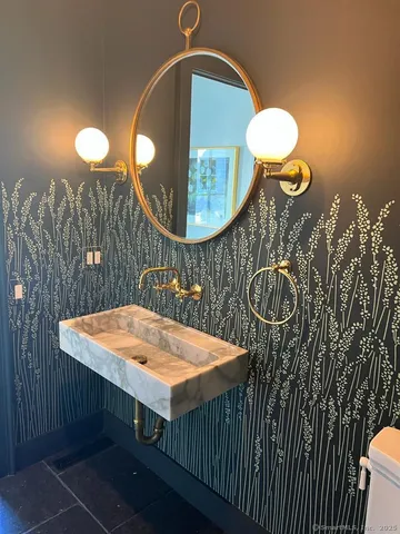 a table with chairs and wooden floor