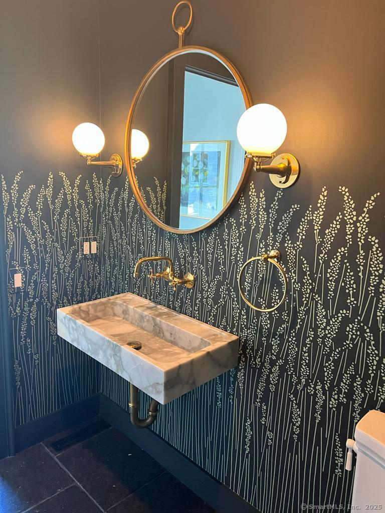 Undisclosed Address Litchfield, CT 06759 - Photo 9 of 22 a table with chairs and wooden floor