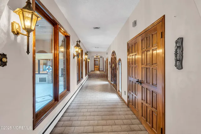a spacious bathroom with a granite countertop sink mirror and a shower