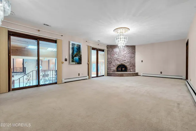 a view of a livingroom with wooden floor and a window