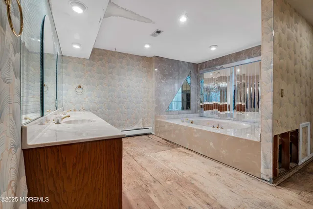 a bathroom with a sink and a mirror