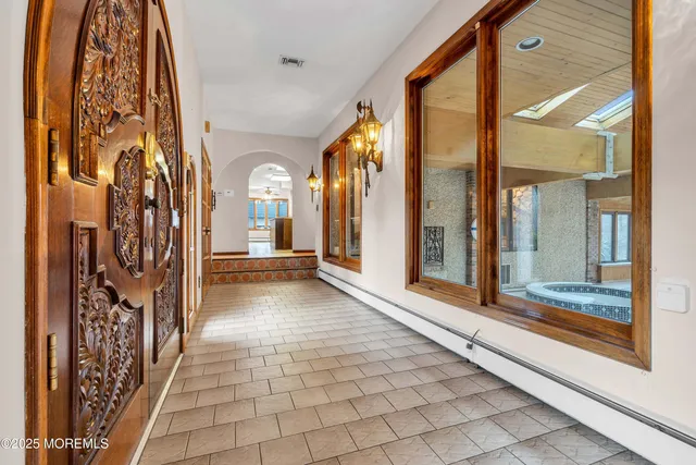 a view of a hallway with windows