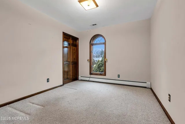 a view of a room with wooden walls