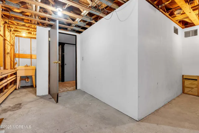 a view of a house with a big yard and large trees