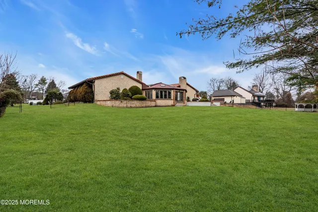 a view of a house with a yard
