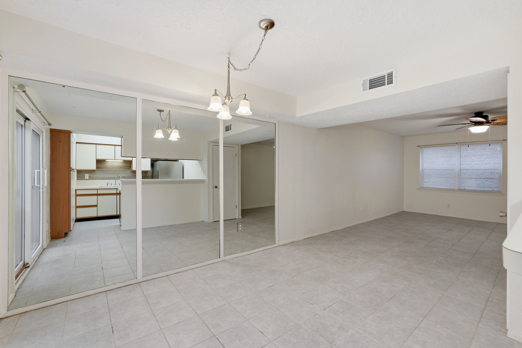 1433 Cedar Post Lane, Unit 40 Houston, TX 77055 - Photo 3 of 25 Overview Photo -
Kitchen is shown in the mirror. Dining in front of photographer. Living room is to the right.