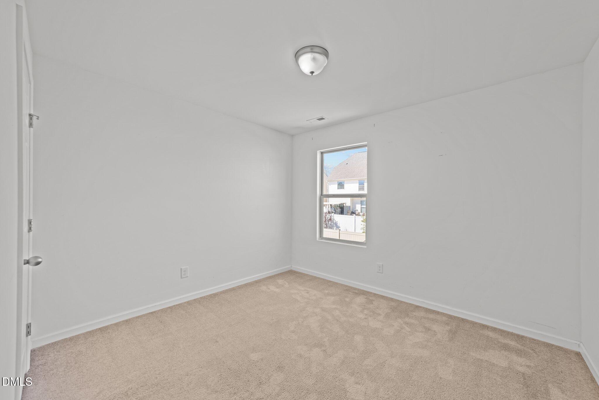 1445 Lombar Street Raleigh, NC 27610 - Photo 14 of 20 an empty room with a window