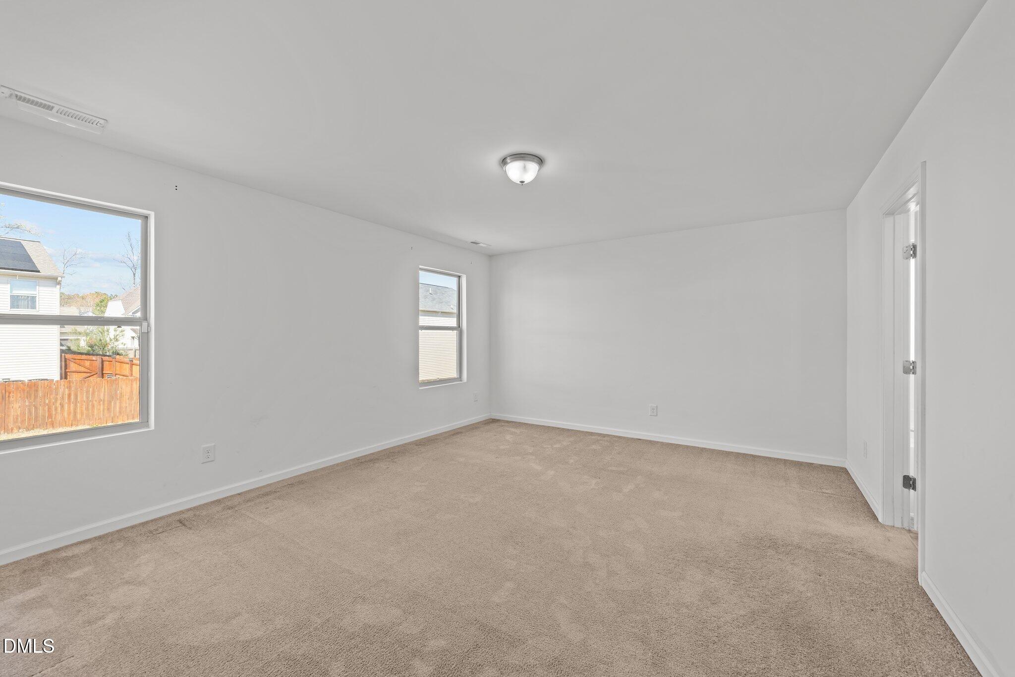1445 Lombar Street Raleigh, NC 27610 - Photo 16 of 20 a view of an empty room with a window
