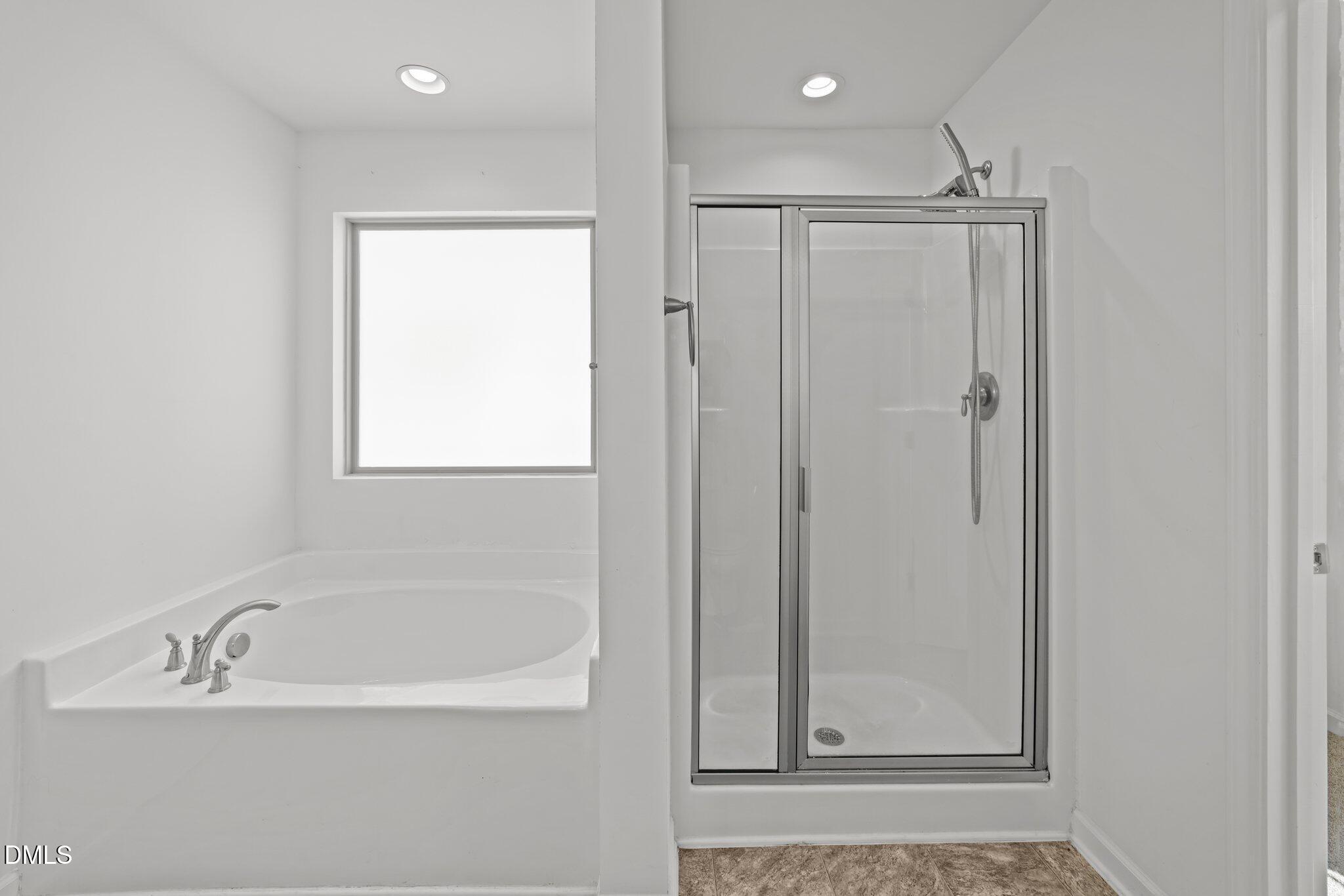 1445 Lombar Street Raleigh, NC 27610 - Photo 19 of 20 a white bath tub sitting next to a shower