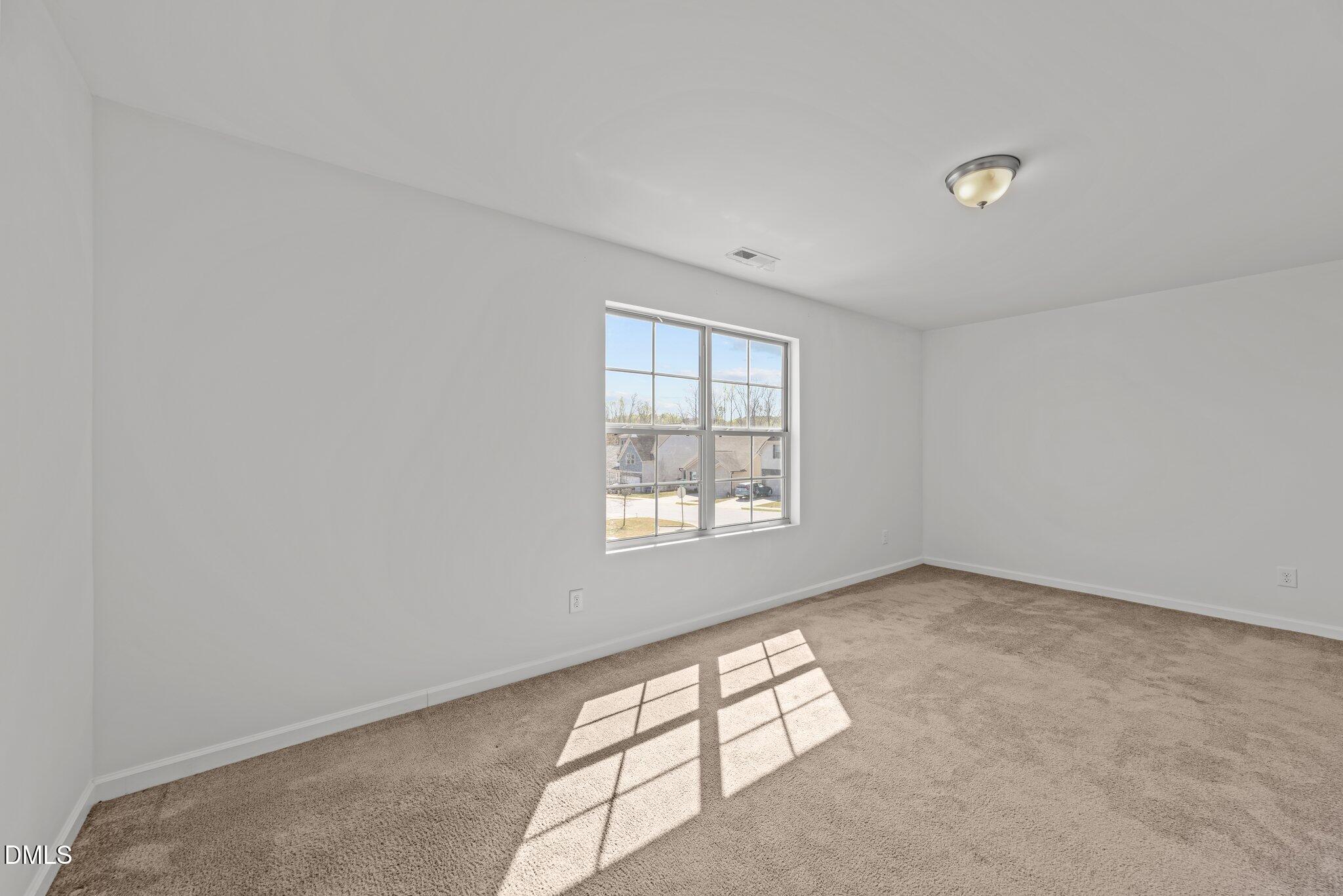1445 Lombar Street Raleigh, NC 27610 - Photo 10 of 20 an empty room with windows