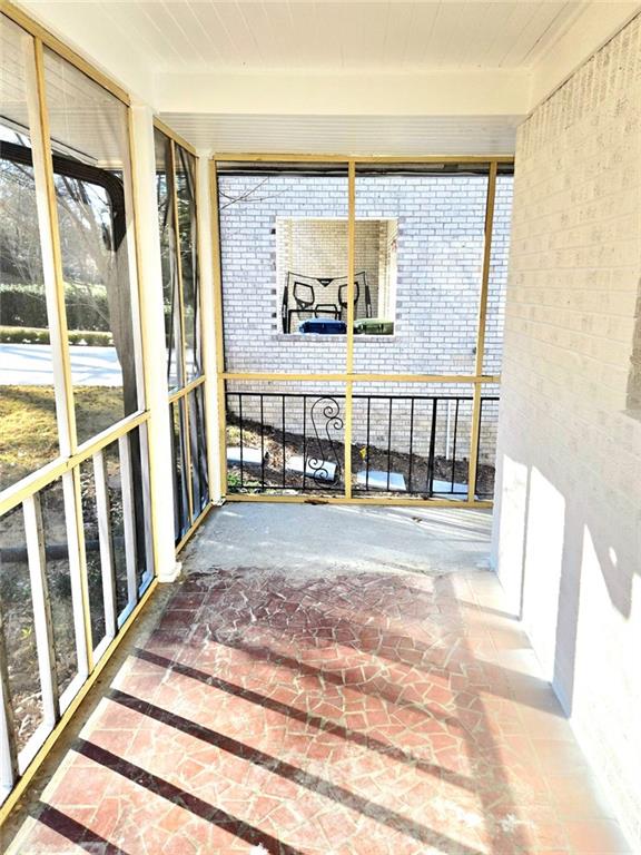 522 Wimbledon Road Northeast Atlanta, GA 30324 - Photo 14 of 15 a living room with a large window and a table