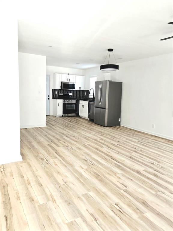 522 Wimbledon Road Northeast Atlanta, GA 30324 - Photo 2 of 15 a kitchen with stainless steel appliances a stove and a refrigerator