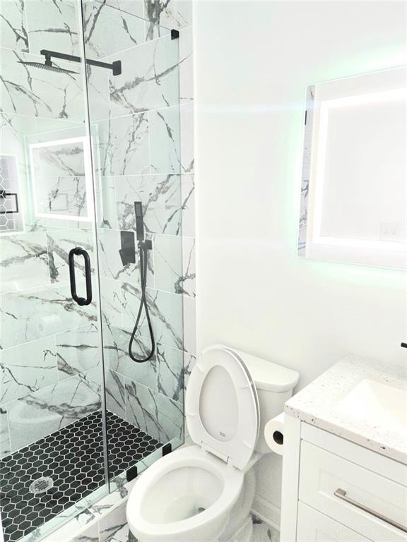 522 Wimbledon Road Northeast Atlanta, GA 30324 - Photo 4 of 15 a bathroom with a toilet sink and shower