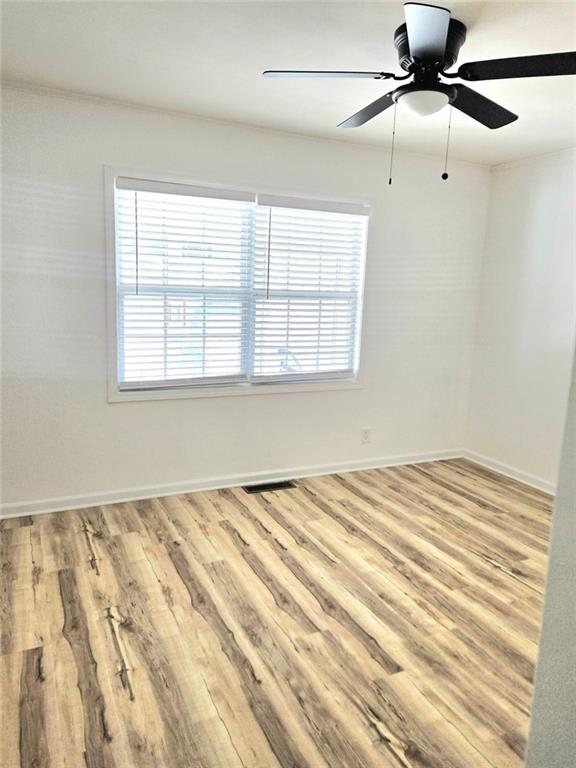 522 Wimbledon Road Northeast Atlanta, GA 30324 - Photo 5 of 15 a view of a bedroom with a bed and a window