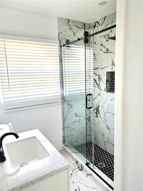 522 Wimbledon Road Northeast Atlanta, GA 30324 - Photo 7 of 15 a bathroom with a shower and a sink