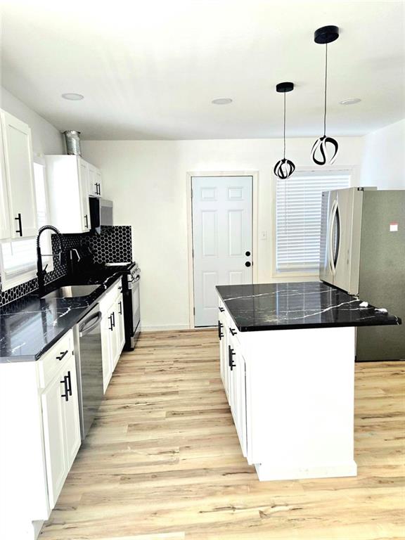 522 Wimbledon Road Northeast Atlanta, GA 30324 - Photo 8 of 15 a kitchen with a sink and a stove