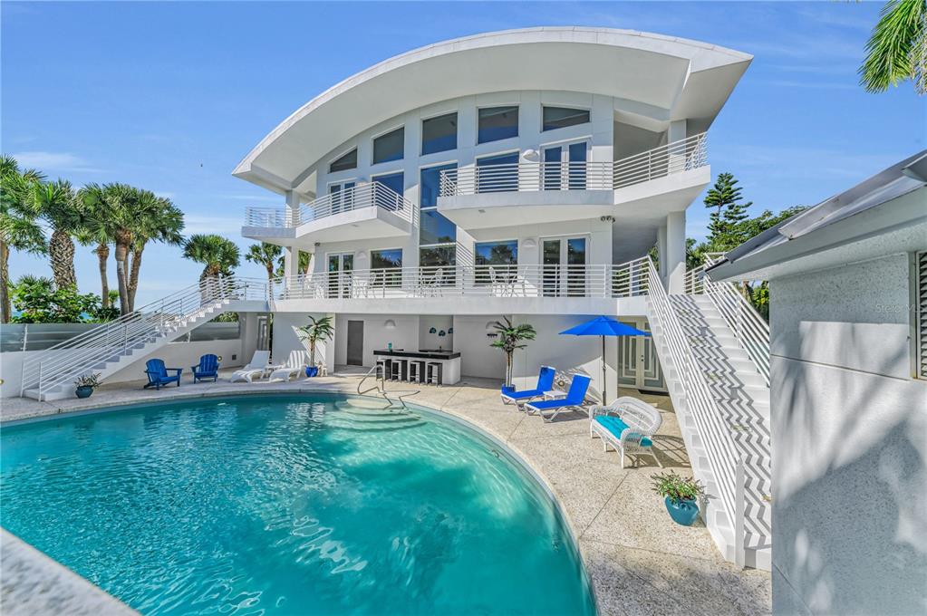 773 North Manasota Key Road Englewood, FL 34223 - Photo 1 of 1 a front view of a house with outdoor seating