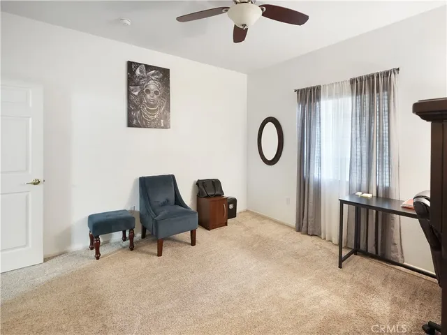 a bedroom with furniture and a window