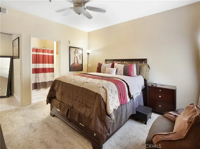 a spacious bedroom with a bed and window