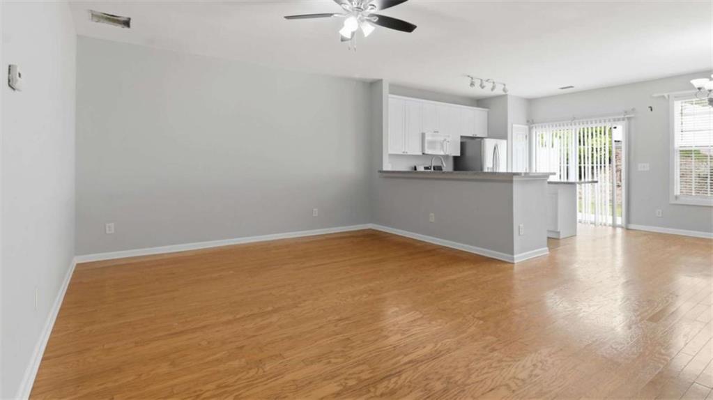 3522 Spring View Court Alpharetta, GA 30004 - Photo 6 of 25 wooden floor in an empty room with a window