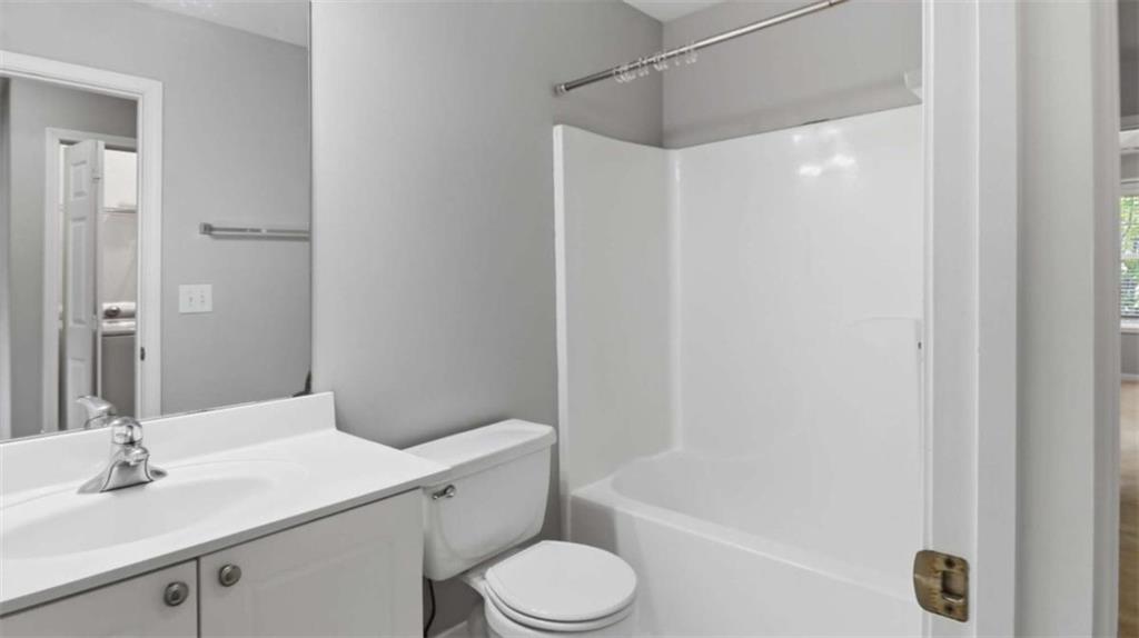 3522 Spring View Court Alpharetta, GA 30004 - Photo 9 of 25 a bathroom with a sink toilet and shower