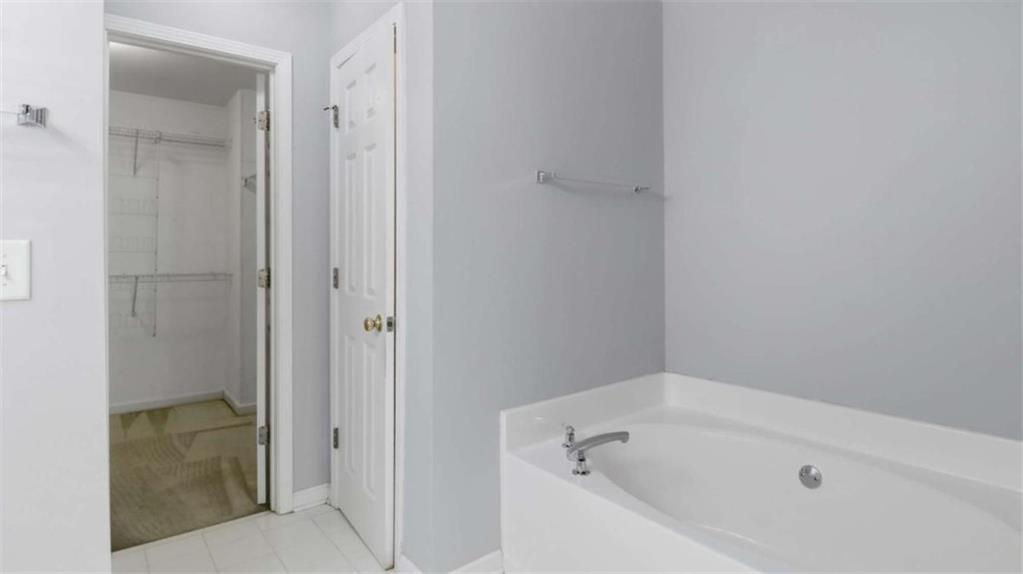 3522 Spring View Court Alpharetta, GA 30004 - Photo 10 of 25 a bathroom with a tub