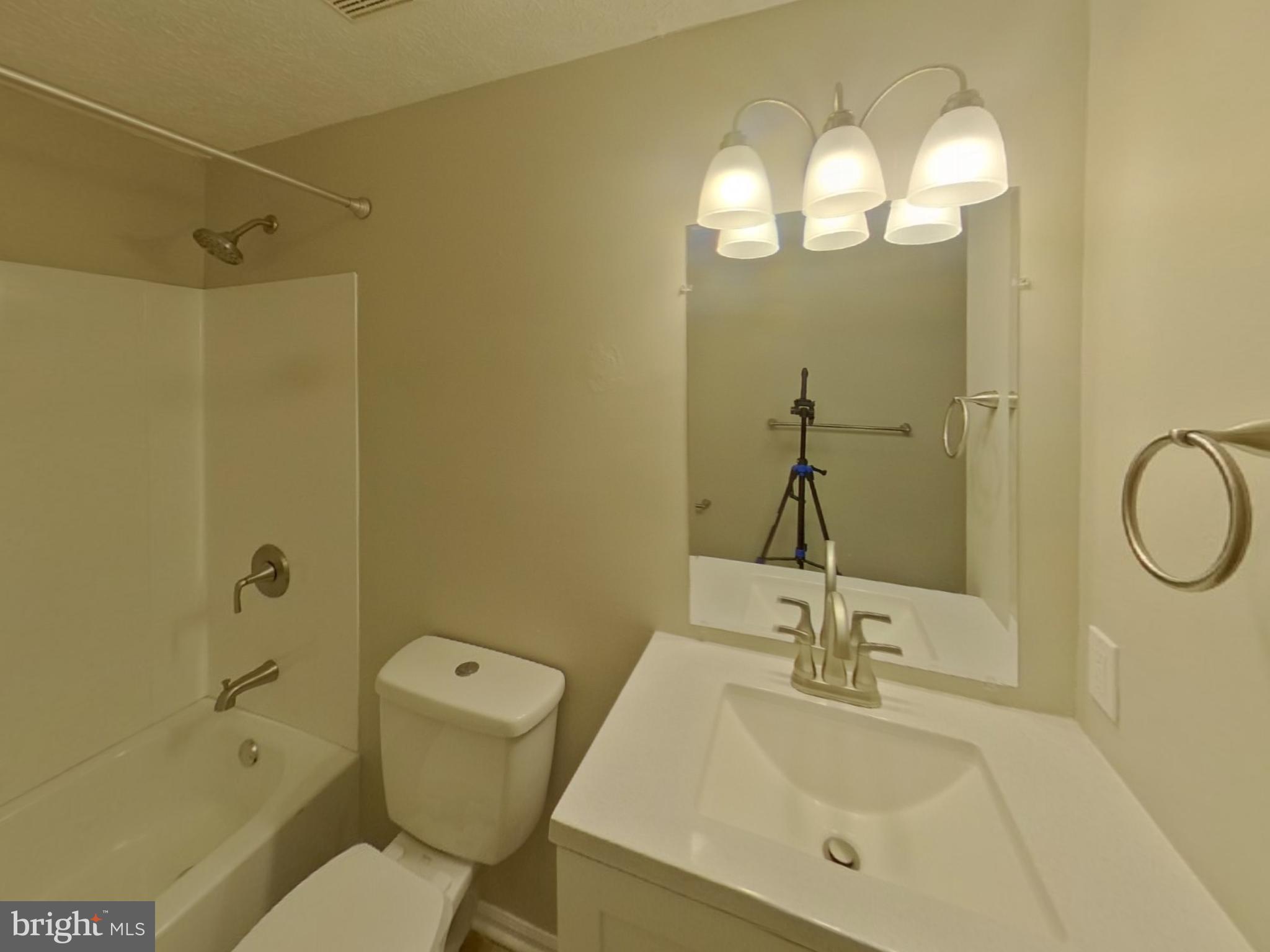 3776 Timahoe Circle Baltimore, MD 21236 - Photo 11 of 16 a bathroom with a sink a toilet and shower