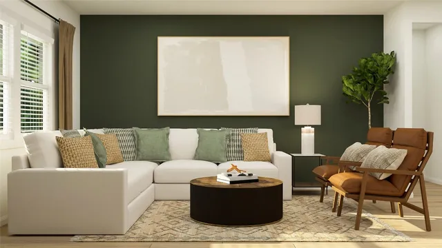 a living room with furniture and a potted plant