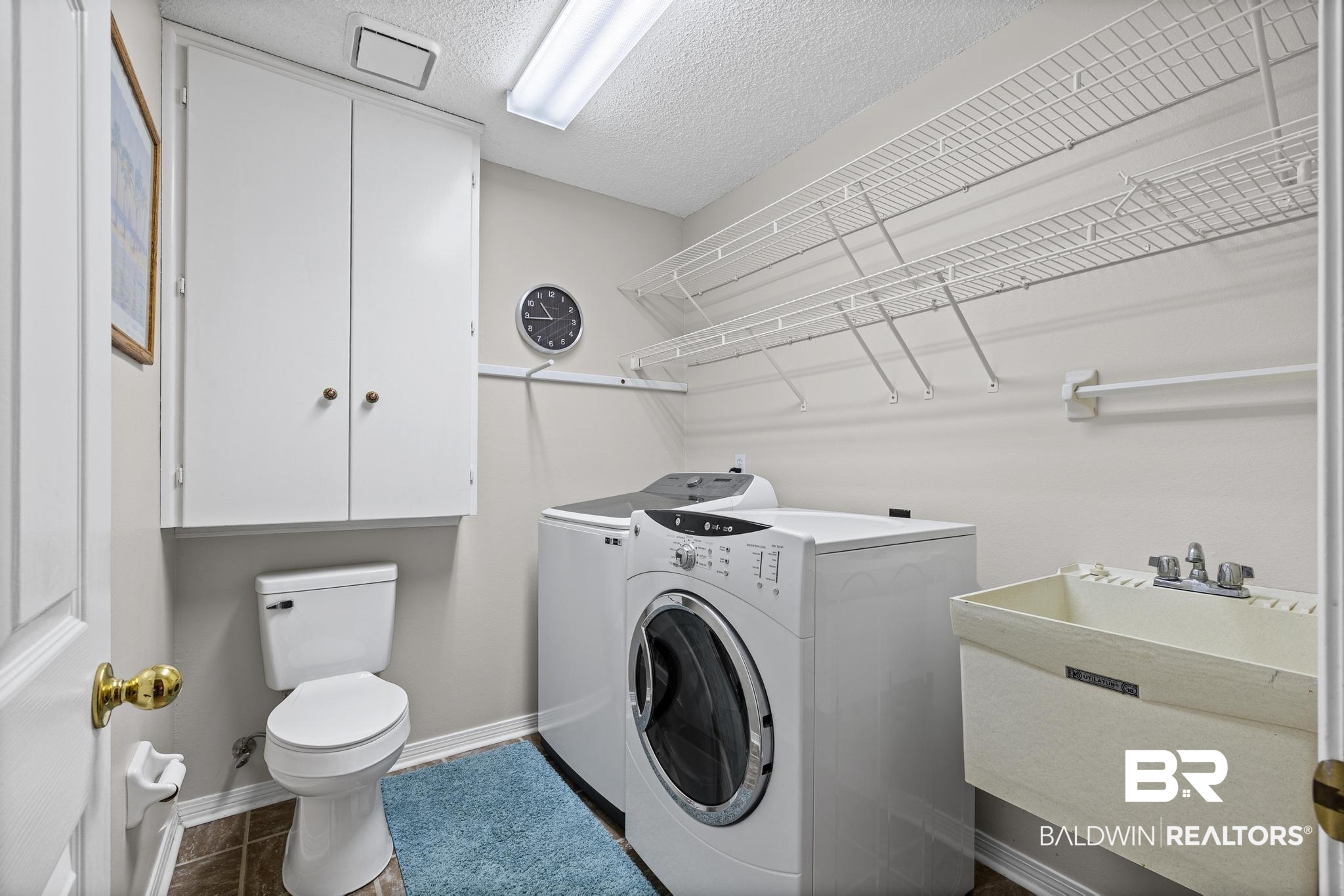 2881 Eslava Circle Lillian, AL 36549 - Photo 15 of 58 Laundry area featuring independent washer and dryer and a textured ceiling