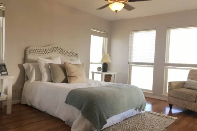 a bedroom with a bed and a couch