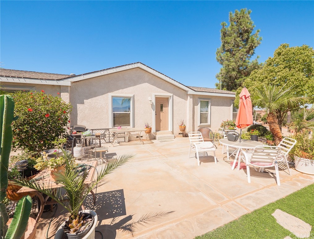 a view of a house with backyard porch and patio